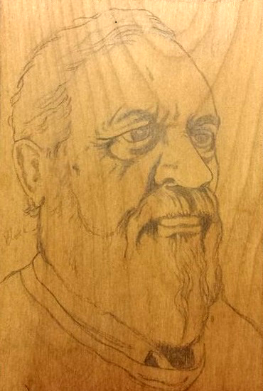 Wood block with pencil self portrait ready for woodcut